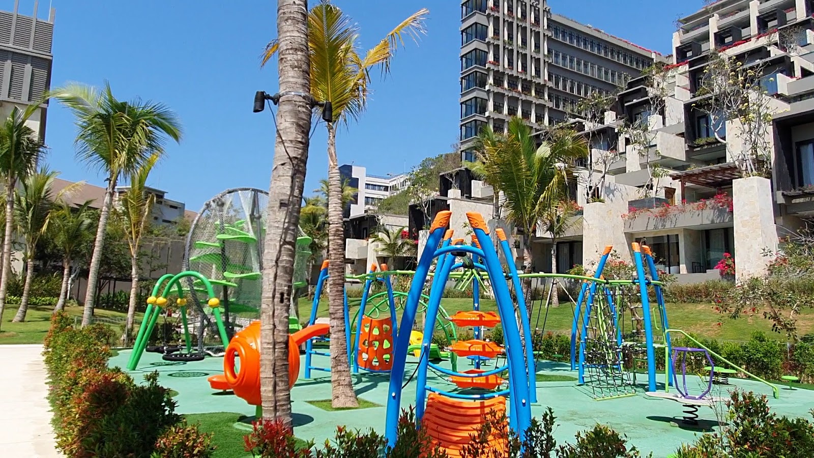 Kids playground with swings at The Apurva Kempinski Bali