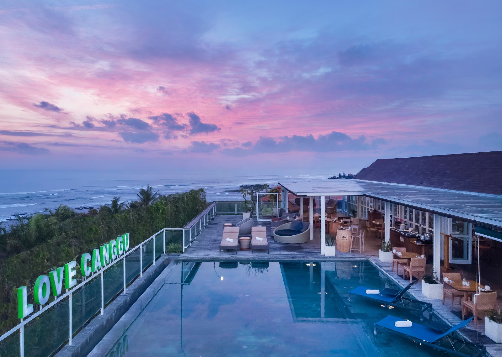 Rooftop pool at sunset at ASTON Canggu Beach Resort