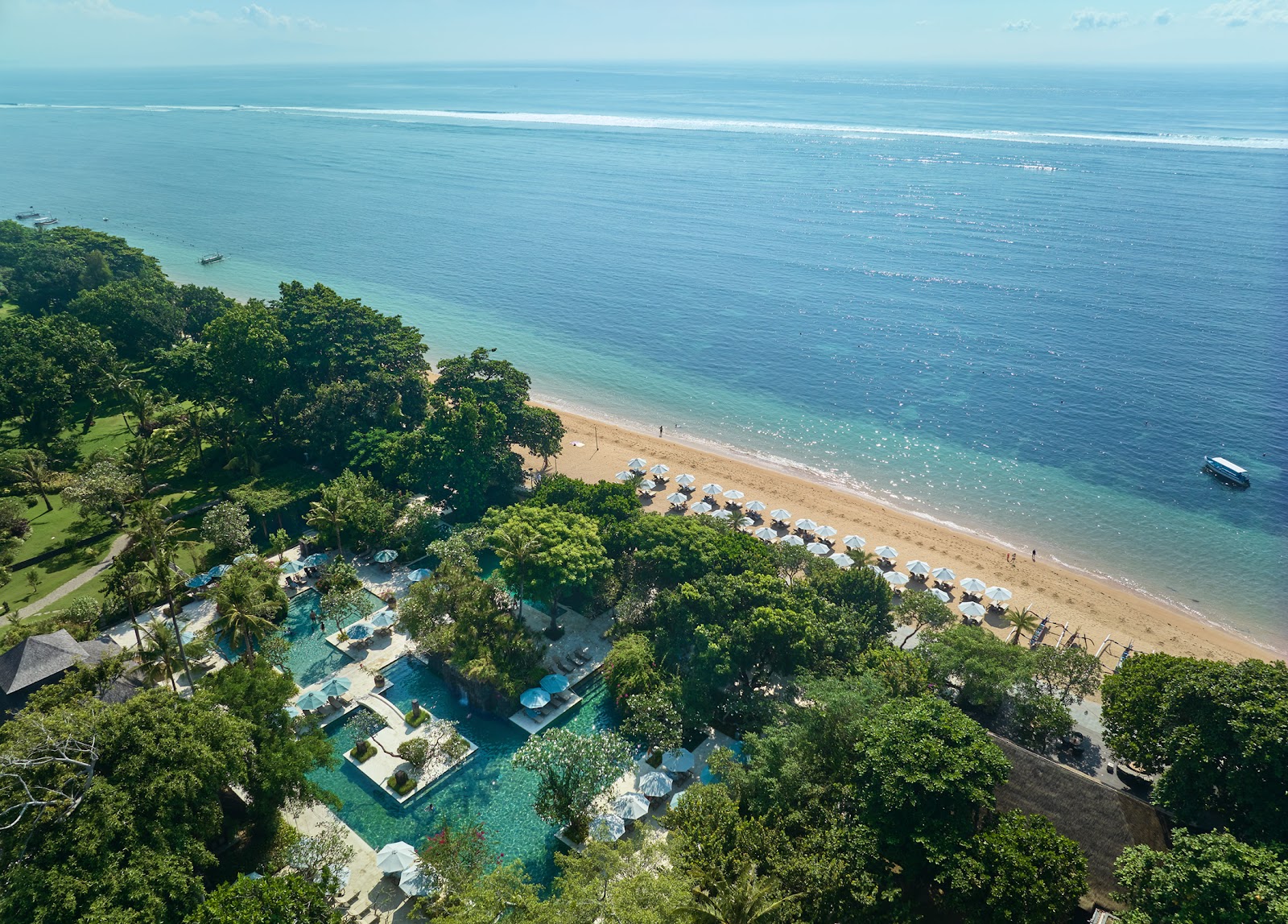 Aerial view of the calm Sanur beachfront, home to the best family friendly hotels in Sanur