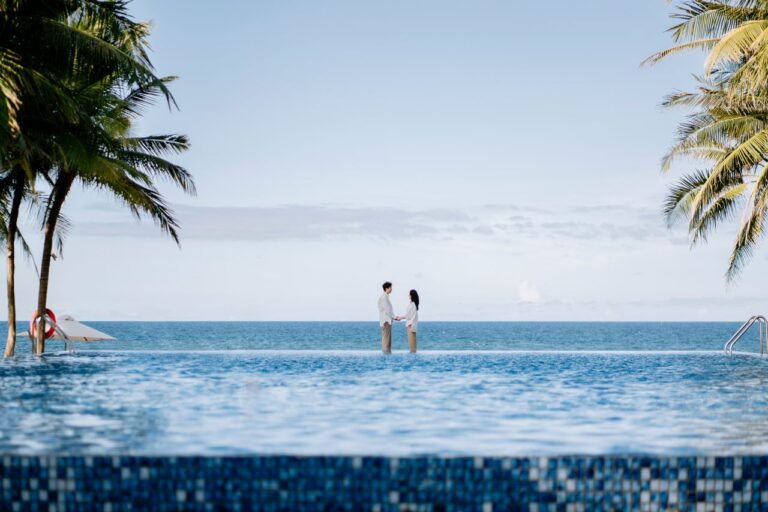 Guests relaxing in an infinity pool, a highlight of the best family friendly hotels in Uluwatu