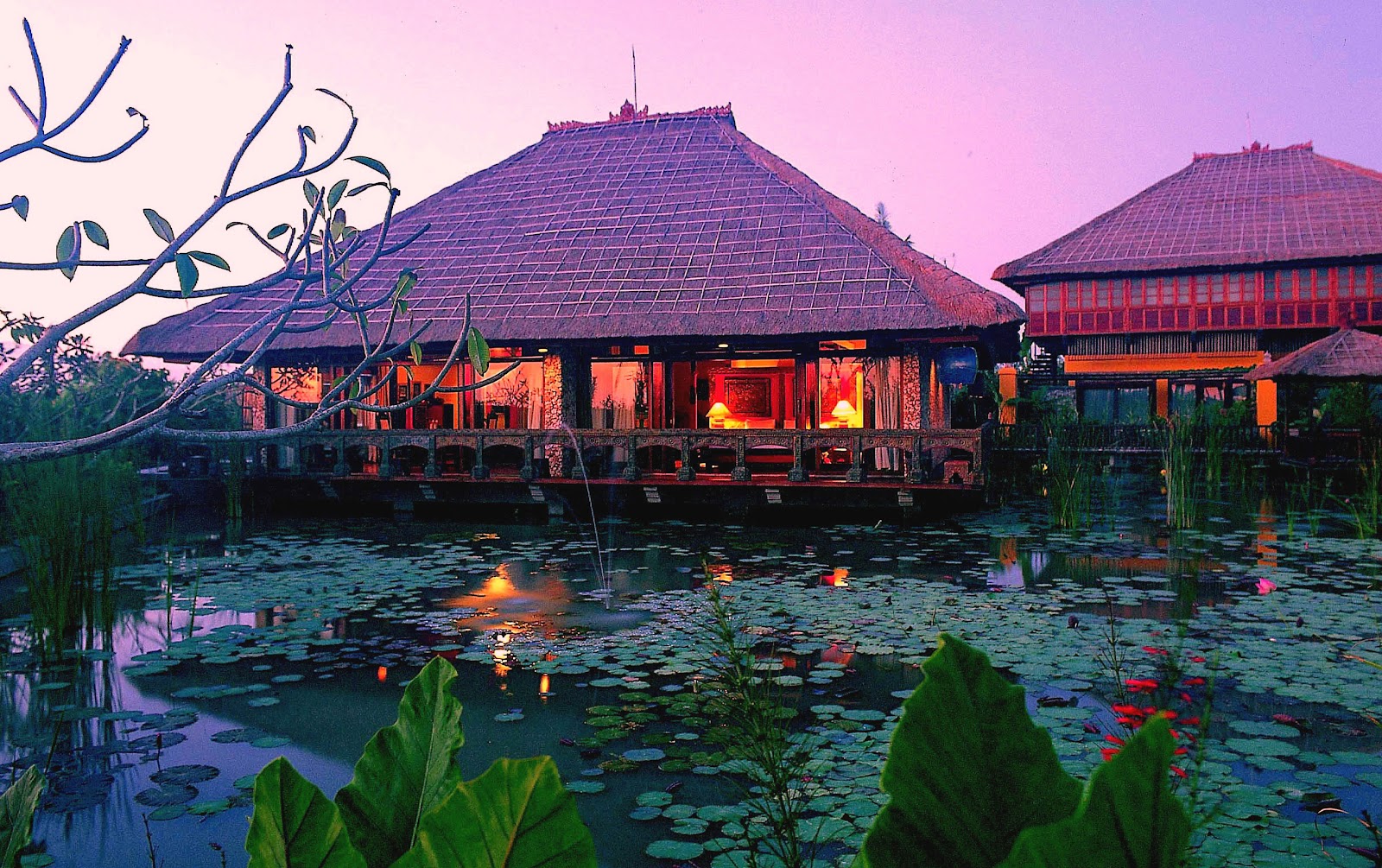 Hotel Tugu Bali traditional pavilion over a lotus pond at sunset