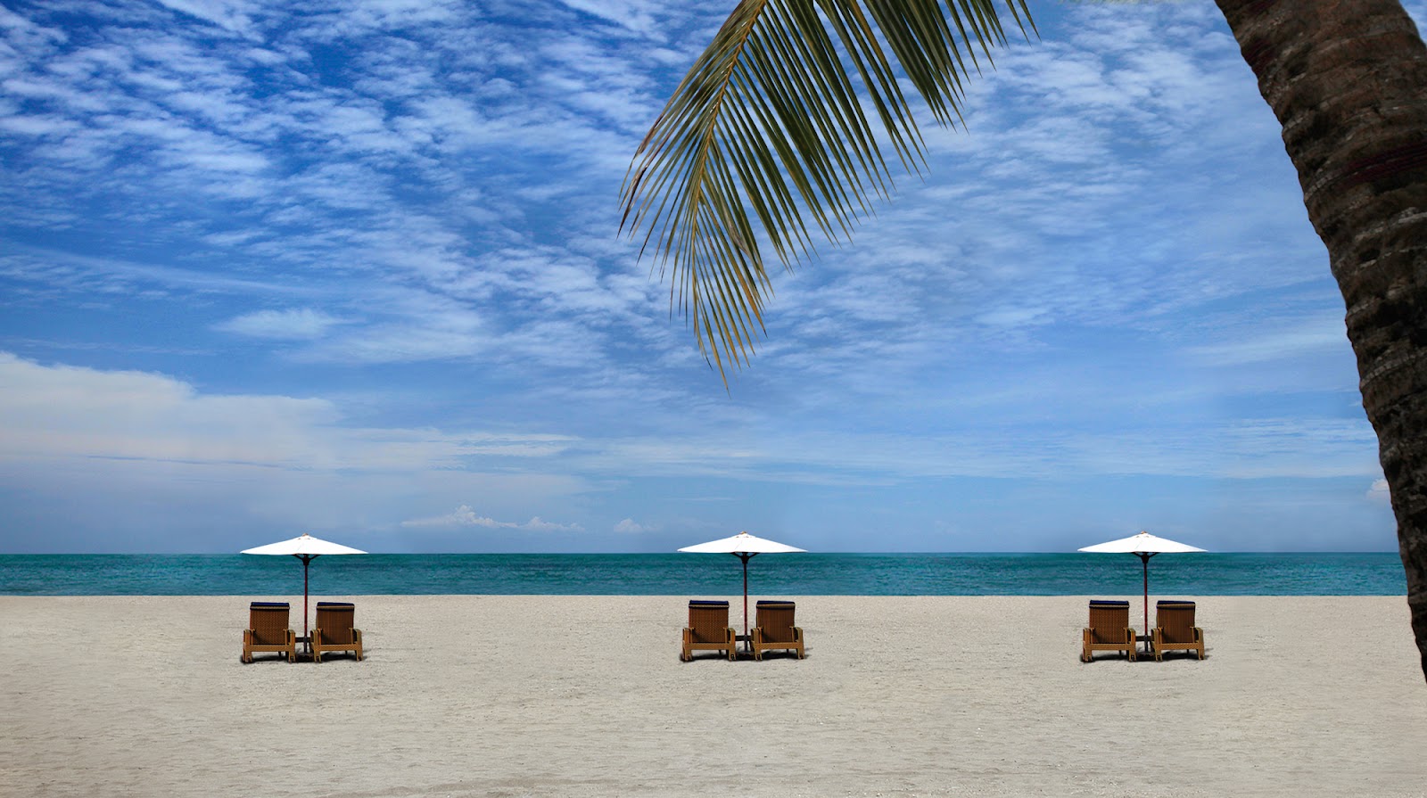 Sun loungers and umbrellas on Kuta Beach