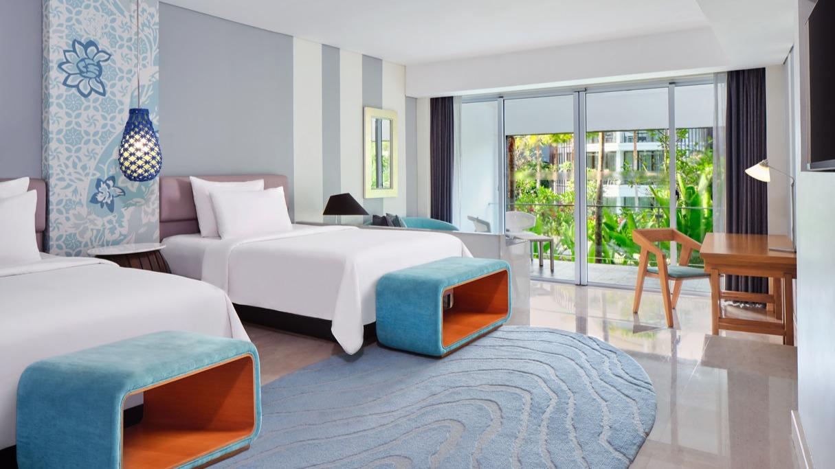 Bright guest room at Le Meridien Bali Jimbaran, one of the best family friendly hotels in Jimbaran