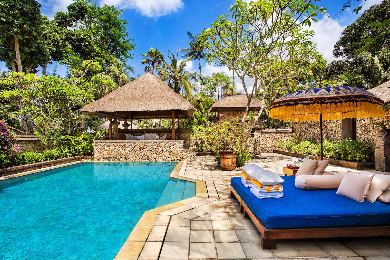 Garden pool with Balinese pavilions at The Oberoi Beach Resort Bali