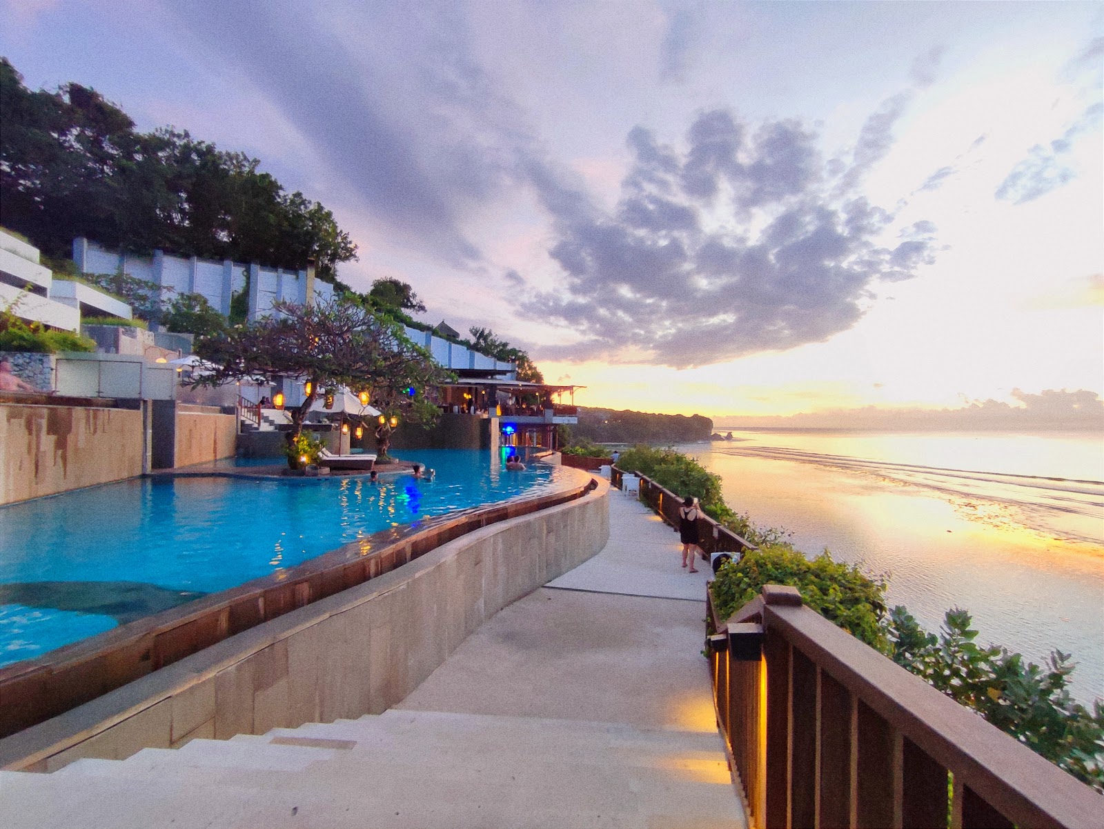 Svanata Uluwatu, formerly Anantara Uluwatu, pool at sunset, a family friendly hotel in Uluwatu