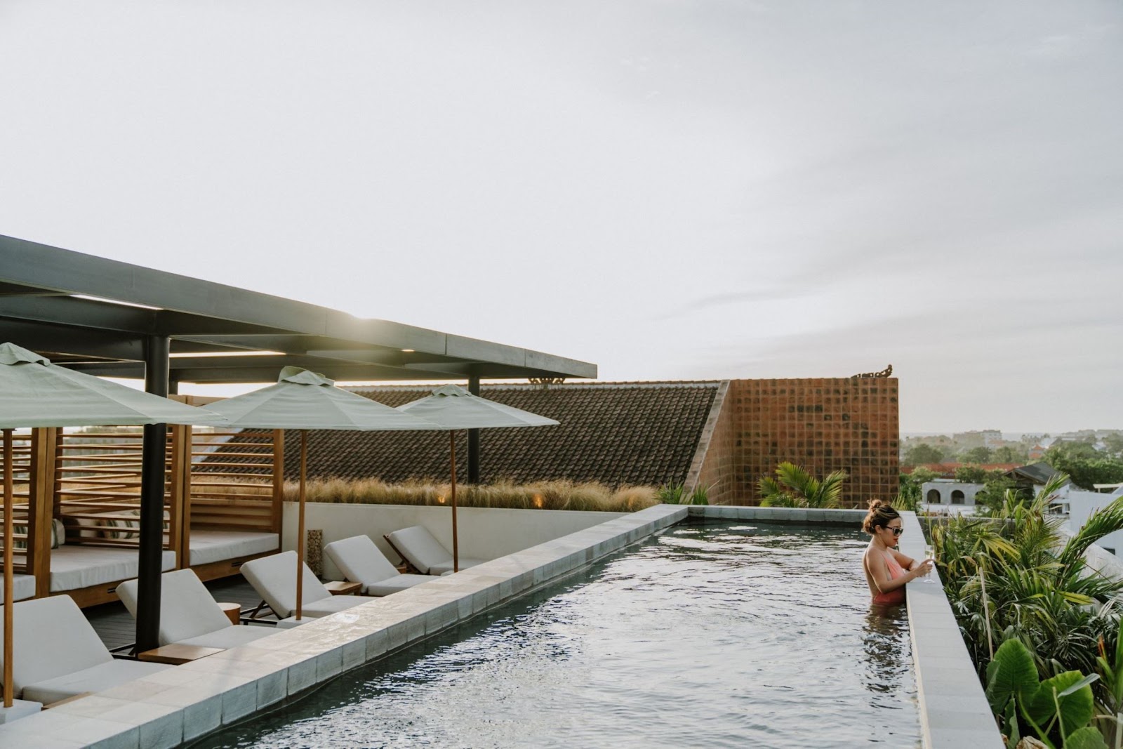Rooftop pool with sea views at The Komu Canggu