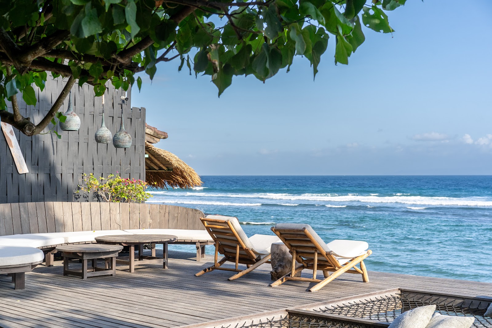 Beach loungers facing the ocean at The Seed Bali