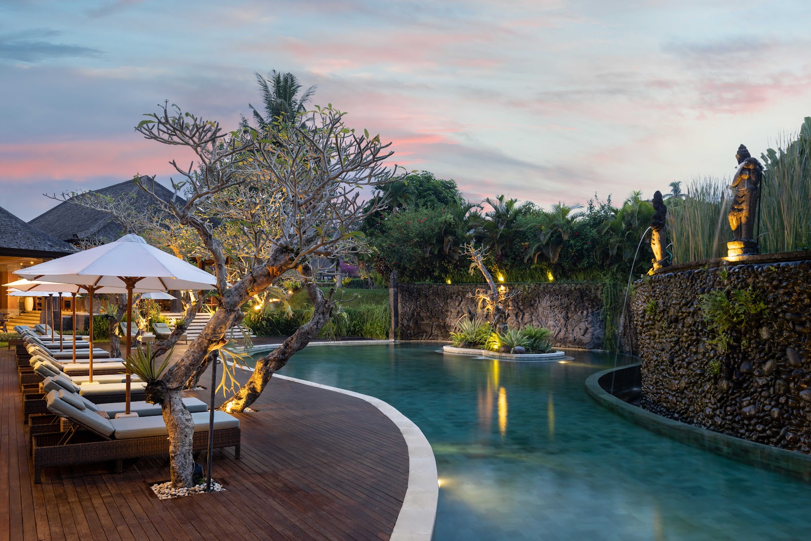Visesa Ubud Resort pool at dusk, a family friendly hotel in Ubud